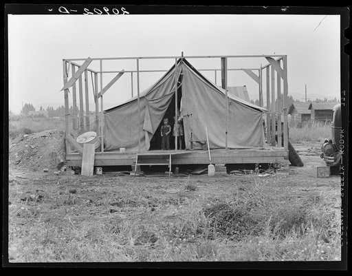 Family living in tent while building the house around them. Near Klamath Falls, Klamath County, Oregon. See general caption number 47