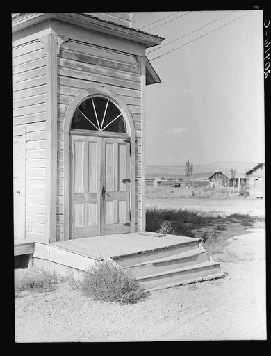 Untitled photo, possibly related to: Old Catholic church on edge of potato town. "The Oakies and Arkies" live four in a room around here. Merrill, Klamath County, Oregon