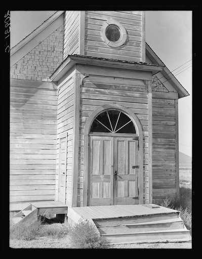Old Catholic church on edge of potato town. "The Oakies and Arkies" live four in a room around here. Merrill, Klamath County, Oregon
