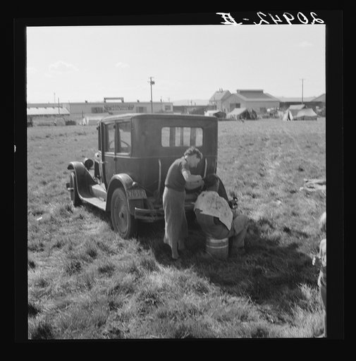 Untitled photo, possibly related to: Living conditions for migrant potato pickers. Note potato sheds across the road. Siskiyou County, California. General caption number 63-1