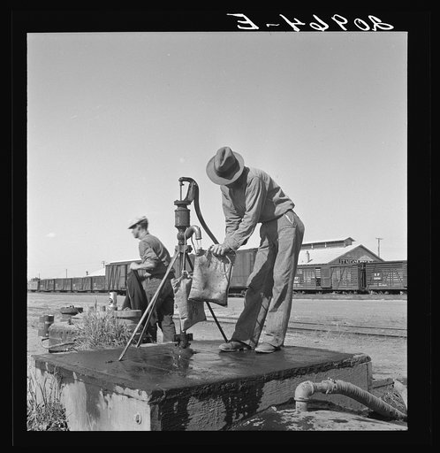 Drinking water for the whole town, also for the migrant camp across the road. Tulelake, Siskiyou County, California. See caption numbers 63-1 and 44