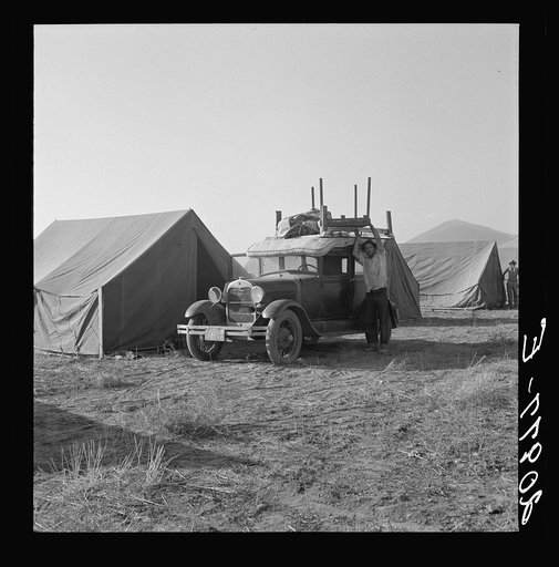 Migratory family, come to Klamath Basin for potato harvest, moving into tent in the new mobile unit. (FSA - Farm Security Administration). Tents are provided. Merrill, Klamath County, Oregon