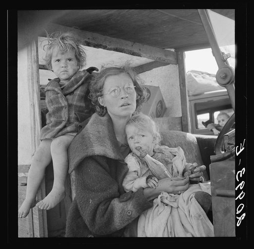 Mother and two children on the road. Tulelake, Siskiyou County, California. General caption number 65
