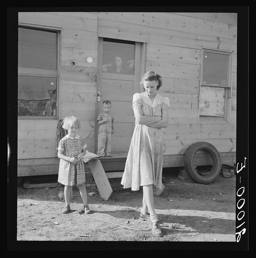 Young mother, twenty five, says "Next year we'll be painted and have a lawn and flowers." Rural shacktown, near Klamath Falls, Oregon. General caption number 47