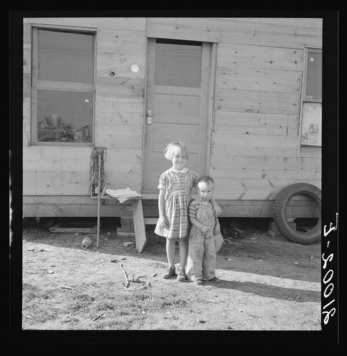 The children, seen in opening of tent in earlier photograph, before their new home. Rural shacktown. Near Klamath Falls, Oregon