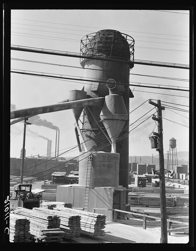 Untitled photo, possibly related to: Lumber burner and stacks of the Big Lakes Lumber Company, which produces box shook for produce boxes. Klamath Falls, Oregon