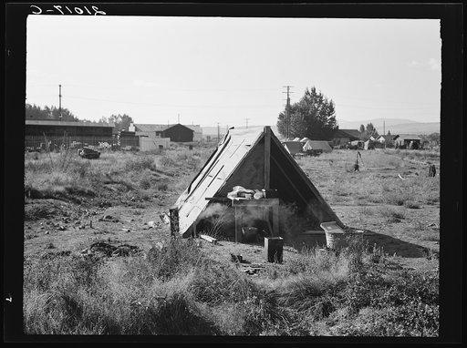 Untitled photo, possibly related to: One of the forty potato camps in open field, entering town. Malin, Klamath County, Oregon. General caption number 64