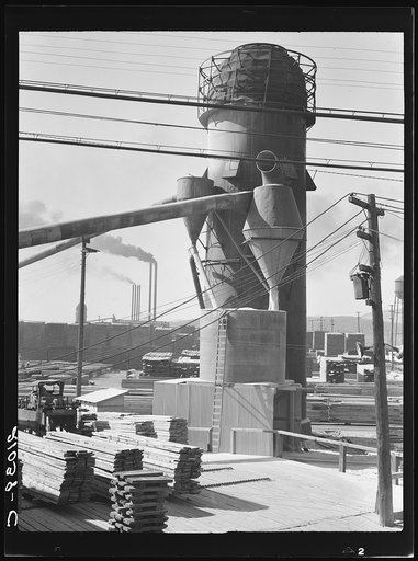 Lumber burner and stacks of the Big Lakes Lumber Company, which produces box shook for produce boxes. Klamath Falls, Oregon