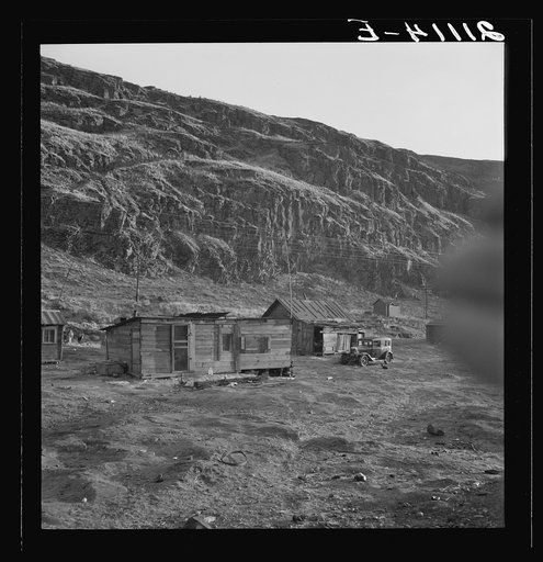 Untitled photo, possibly related to: Yakima Indian village, on the Columbia River, inhabited during salmon season. After the fishing is over they return to the Yakima Valley. Indian girl: "They don't want to live better. The government is trying to make them." Celilo, Wasco County, Oregon