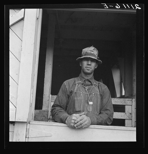 Mr. Granger, seen in doorway of his new barn. Yamhill County, Willamette Valley, Oregon. Yamhill farms FSA (Farm Security Administration) project. General caption number 57