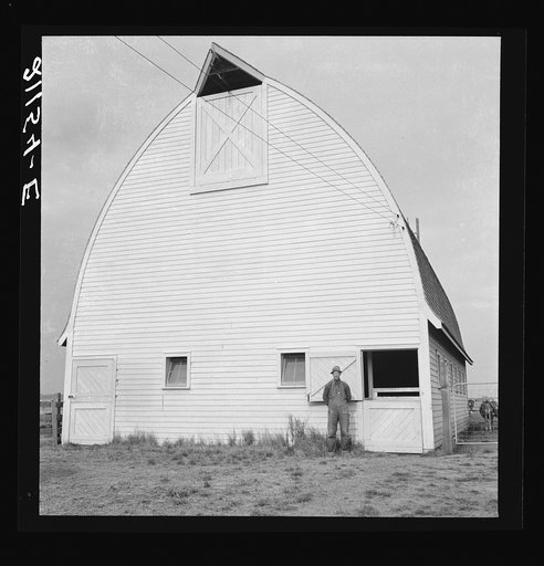 Farmer from Nebraska and his new barn on the Yamhill farms (FSA - Farm Security Administration) project. Yamhill County, Oregon. General caption number 57