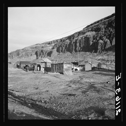Untitled photo, possibly related to: Yakima Indian village, on the Columbia River, inhabited during salmon season. After the fishing is over they return to the Yakima Valley. Indian girl: "They don't want to live better. The government is trying to make them." Celilo, Wasco County, Oregon