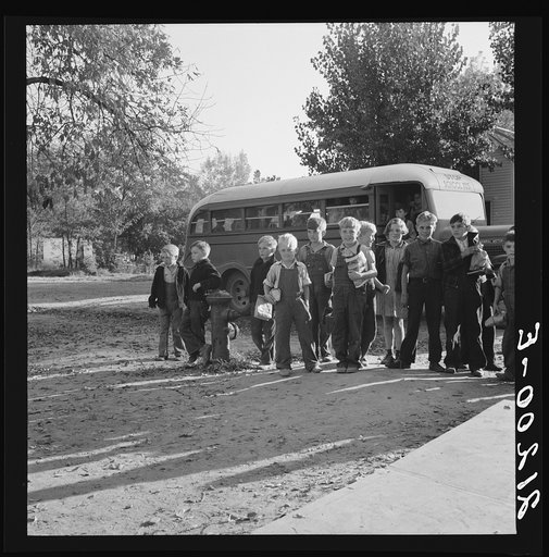 Untitled photo, possibly related to: The children from Dead Ox Flat get off bus at school yard. Ontario, Malheur County, Oregon. General caption number 67-1V