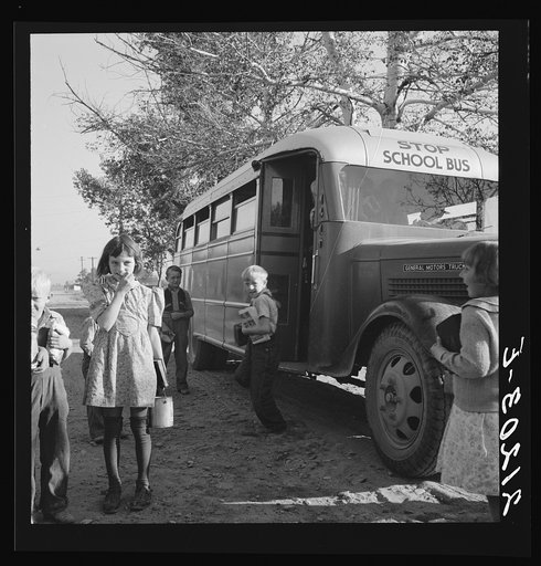 Untitled photo, possibly related to: The children from Dead Ox Flat get off bus at school yard. Ontario, Malheur County, Oregon. General caption number 67-1V