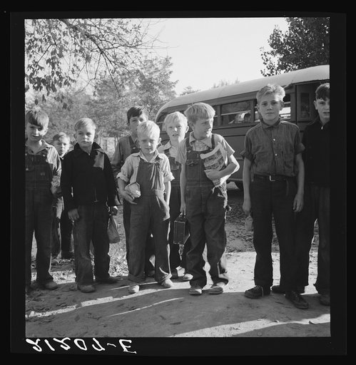The children from Dead Ox Flat get off bus at school yard. Ontario, Malheur County, Oregon. General caption number 67-1V