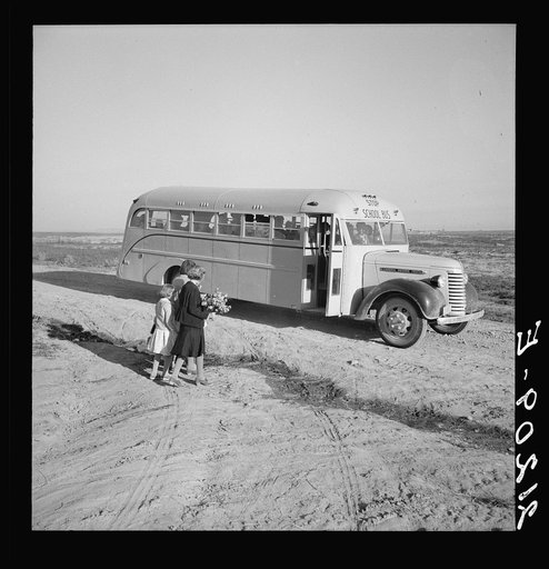 Untitled photo, possibly related to: Dead Ox Flat. Children get into school bus on a fall morning. Malheur County, Oregon. General caption number 67-1V