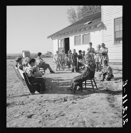 Entire enrollment of Lincoln Bench School. Teacher in center. Near Ontario, Oregon, Malheur County. General caption number 69
