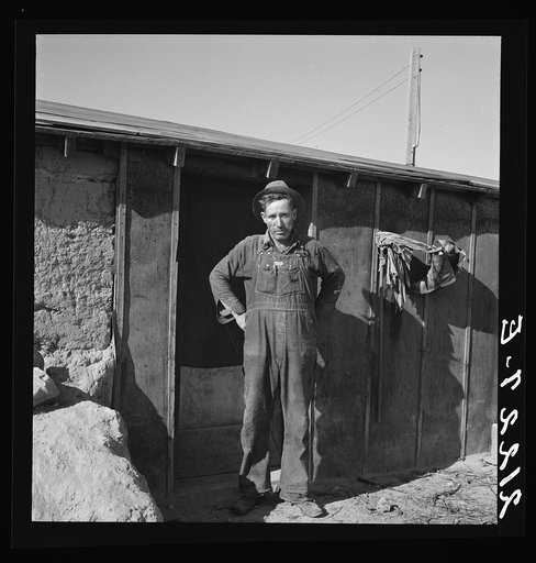 Mr. Roberts in front of his Owyhee project home. Malheur County, Oregon. General caption number 73