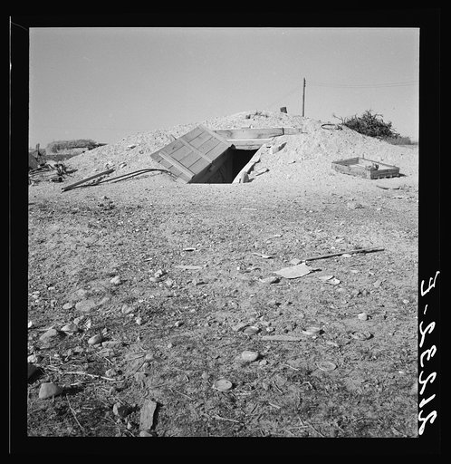 Untitled photo, possibly related to: Abode basement dugout house on Roberts' farm. Willow Creek area. Malheur County, Oregon. General caption number 73