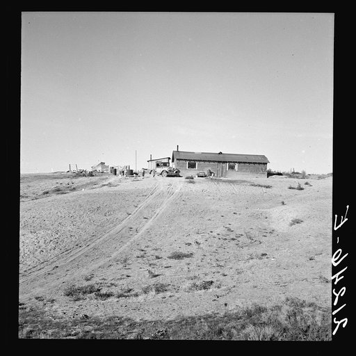 Untitled photo, possibly related to: The Browning home, a partial dugout. Seven children live here. Dead Ox Flat, Malheur County, Oregon. General caption number 67