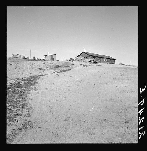 Untitled photo, possibly related to: The Browning home, a partial dugout. Seven children live here. Dead Ox Flat, Malheur County, Oregon. General caption number 67