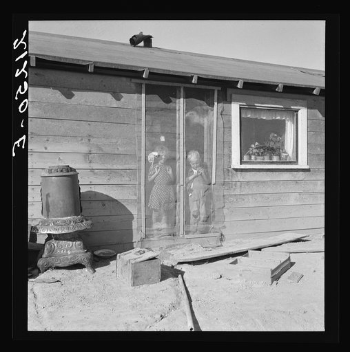 Two of the seven Browning children in doorway of their Oregon home. Dead Ox Flat. Malheur County, Oregon. General Caption number 67-111