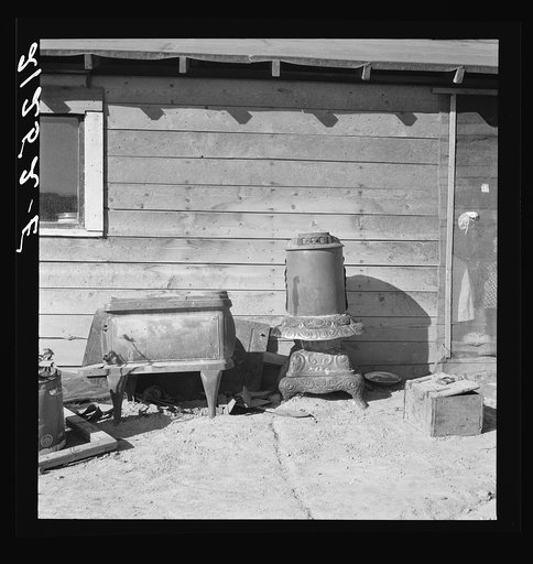 Stoves outside the Browning house being repaired for winter use. Dead Ox Flat, Malheur County, Oregon. General caption 67-111