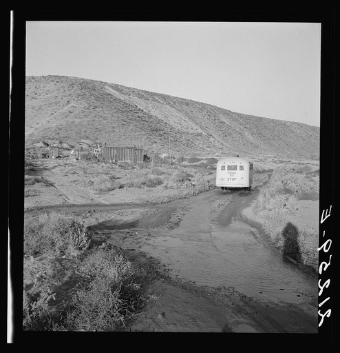 School bus starts up the flat 7:30 a.m. to collect children of new settlers. Malheur County, Oregon. General caption 67-1V