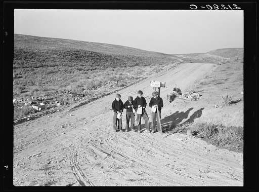 Untitled photo, possibly related to: Boys wait for school bus in the morning. Malheur County, Oregon. General caption number 67-1V