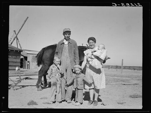 Boys wait for school bus in the morning. Malheur County, Oregon. General caption number 67-1V
