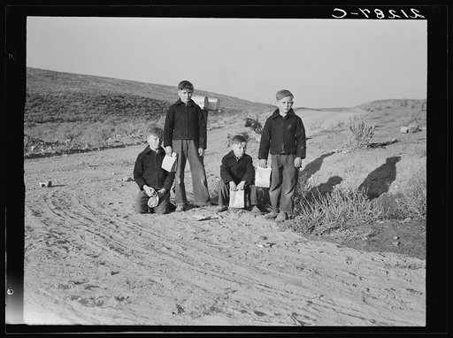 Boys wait for school bus in the morning. Malheur County, Oregon. General caption number 67-1V