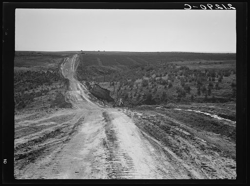 Landscape on top of bench, showing new lands, and farms beyond. Road was built by the CCC (Civilian Conservation Corps). Dead Ox Flat, Malheur County, Oregon. General caption number 67-1