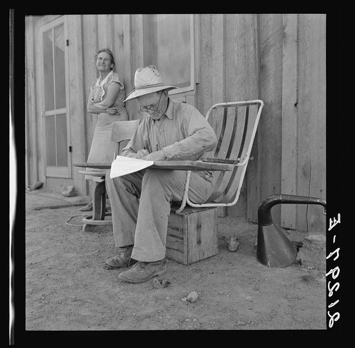 Untitled photo, possibly related to: Oklahoma farmer, now living in Cow Hollow, is a FSA (Farm Security Administration) borrower. Seen here signing his chattel mortgage. Malheur County, Oregon