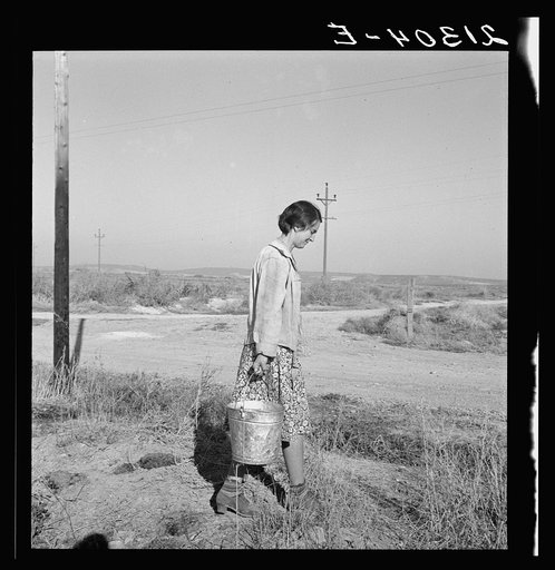 Mrs. Bartheloma hauls water from irrigation ditch. Nyssa Heights, Malheur County, Oregon