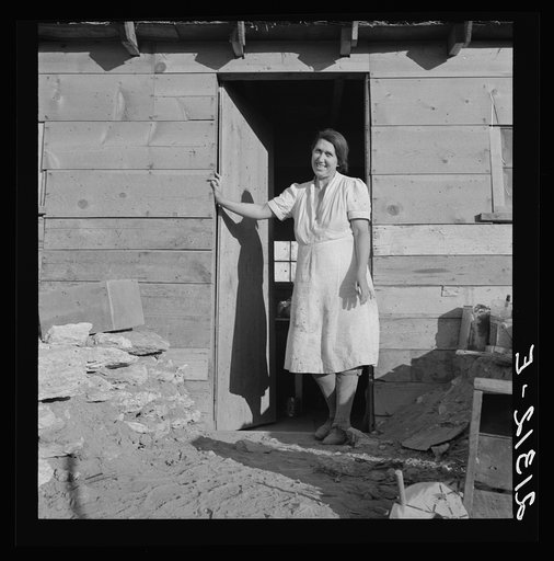 Untitled photo, possibly related to: Mrs. Dougherty in doorway of basement house. Warm Springs, Malheur County, Oregon