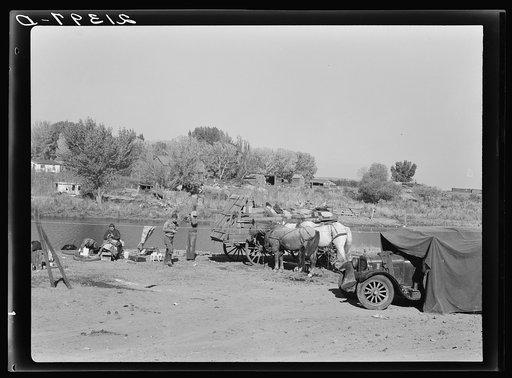 Migrant family cleaning up. Near Vale, Malheur County, Oregon