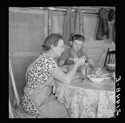 Untitled photo, possibly related to: Mrs. Dazey and sixteen year old at lunch. The other children are working in neighbor's fields topping onions. Homedale district, Malheur County, Oregon