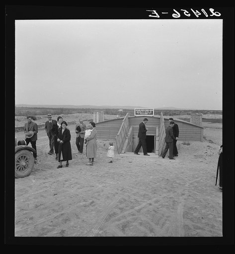 Congregation leaving after services. Preacher in doorway. Dead Ox Flat, Malheur County, Oregon