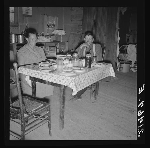 Untitled photo, possibly related to: Mr. Wardlow says grace before dinner. Dead Ox Flat, Malheur County, Oregon