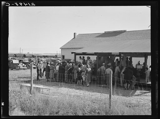 Farmers come to town on Saturday afternoon for auction sale held on back street in Nyssa, Oregon