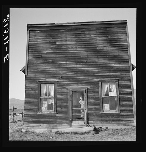 Untitled photo, possibly related to: Member of Ola self help sawmill co-op lives in what was once the "Jacknife Saloon." This type building is characteristic of early Idaho. The stagecoach used to stop here to change horses and for the refreshment of travelers. This was discontinued in 1914. Gem Cou