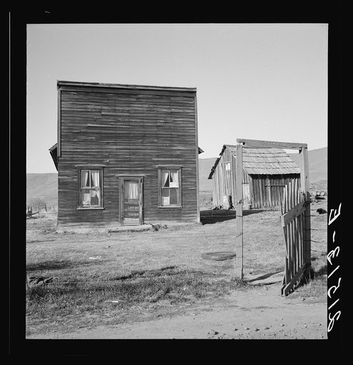 Untitled photo, possibly related to: Farmer saloon and stagecoach tavern which is the temporary home of a member of the Ola self help sawmill co-op. Gem County, Idaho. General caption 48