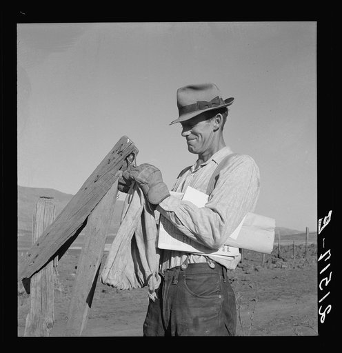 Farmer getting the morning mail. Gem County, Idaho