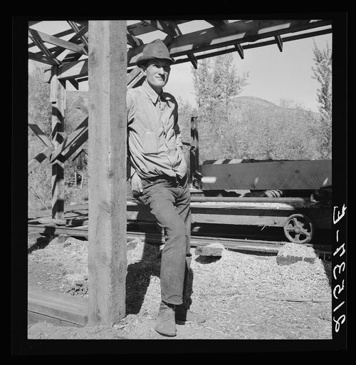 Untitled photo, possibly related to: Men working in mill. Ola self-help sawmill co-op. Gem County, Idaho. Man in rear center in black hat is FSA (Farm Security Administration) county supervisor. General caption 48