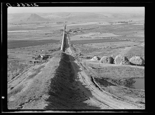 The longest siphon in the world crosses the Malheur Valley. It carries water to the bench land beyond a division of the project called Dead Ox Flat. Malheur County, Oregon. General caption 66-67