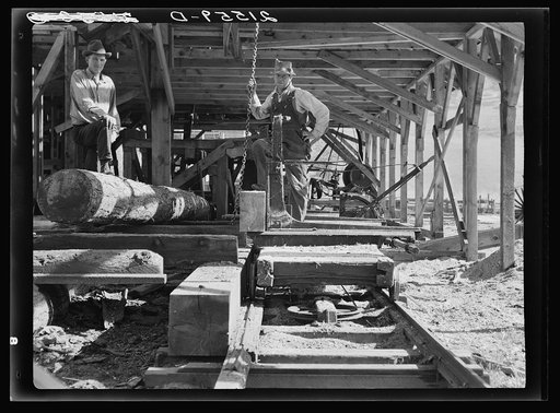 The sawmill carriage and log turner were made by these farmers. Ola self-help sawmill co-op. Gem County, Idaho. General caption 48