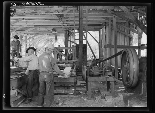 The sawmill in operation. It was built by the farmer members of the Ola self-help sawmill co-op. Gem County, Idaho. General caption 48