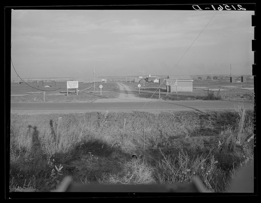 Untitled photo, possibly related to: Entrance to Nyssa Farm family labor camp, FSA (Farm Security Administration) mobile unit number 1, just established before opening of beet season. Near Nyssa, Oregon
