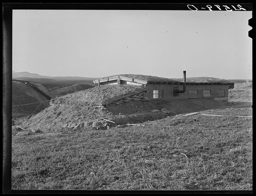 Untitled photo, possibly related to: The Daugherty home. Note siphon which brings irrigation water from the opposite bench. Warm Springs district, Malheur County, Oregon. General caption 74