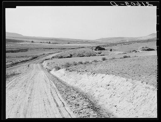 Entering Cow Hollow region in which practically all are FSA (Farm Security Administration) borrowers. These are farmers who had a late start. Malheur County, Oregon. General caption 66